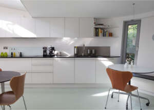 Resin floor in Highgate: seamless RAL 7035 poured resin running through the kitchen at 6 Wood Lane