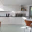 Resin floor in Highgate: seamless RAL 7035 poured resin running through the kitchen at 6 Wood Lane