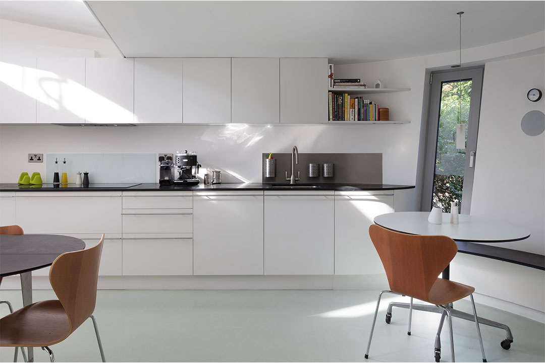 Resin floor in Highgate: seamless RAL 7035 poured resin running through the kitchen at 6 Wood Lane